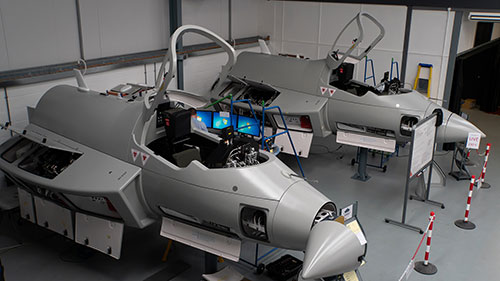 Airframe replicas. They are grey with key parts and panels open