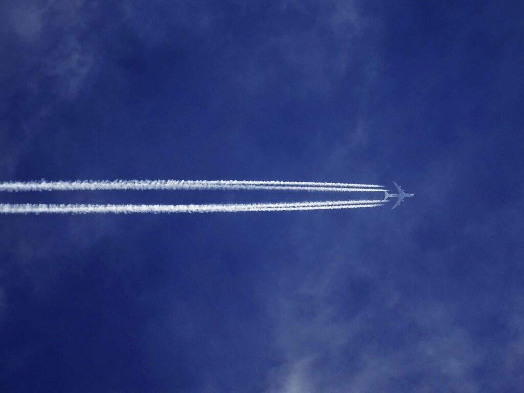 Completion of Acquisition of Aviation Skills Holdings Limited 21 A stock image of a blue sky with a plane flying through it