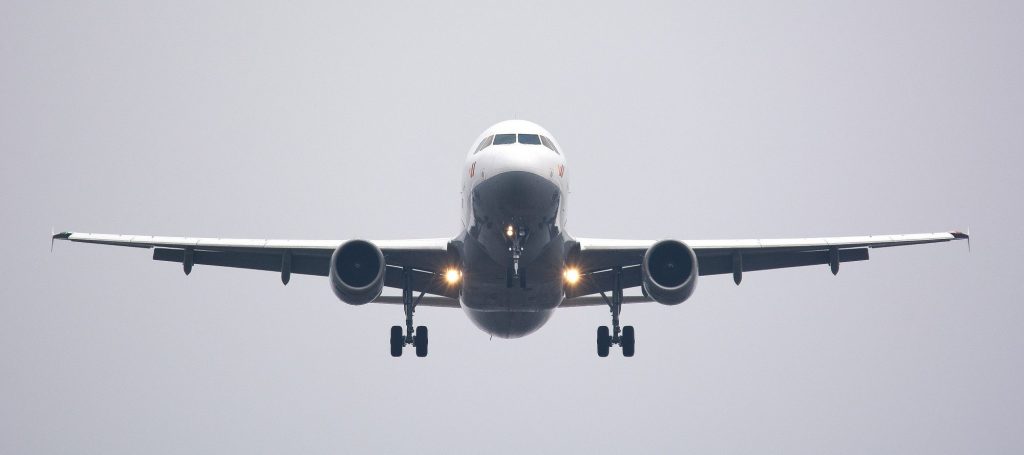 A front facing visual of an aeroplane in a grey sky
