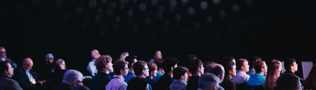 What Events Are Ahead for Pennant in 2025 11 A crowd of people sat in a dark theatre conference room look in the same direction