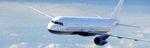 “WHAT YOU NEED TO KNOW ABOUT SPEC 1000BR 4.2 CIVIL AVIATION BUSINESS RULES FOR S1000D ISSUE 4.2” 17 A white and blue plane flying through the sky. The sky is blue with faint white clouds.